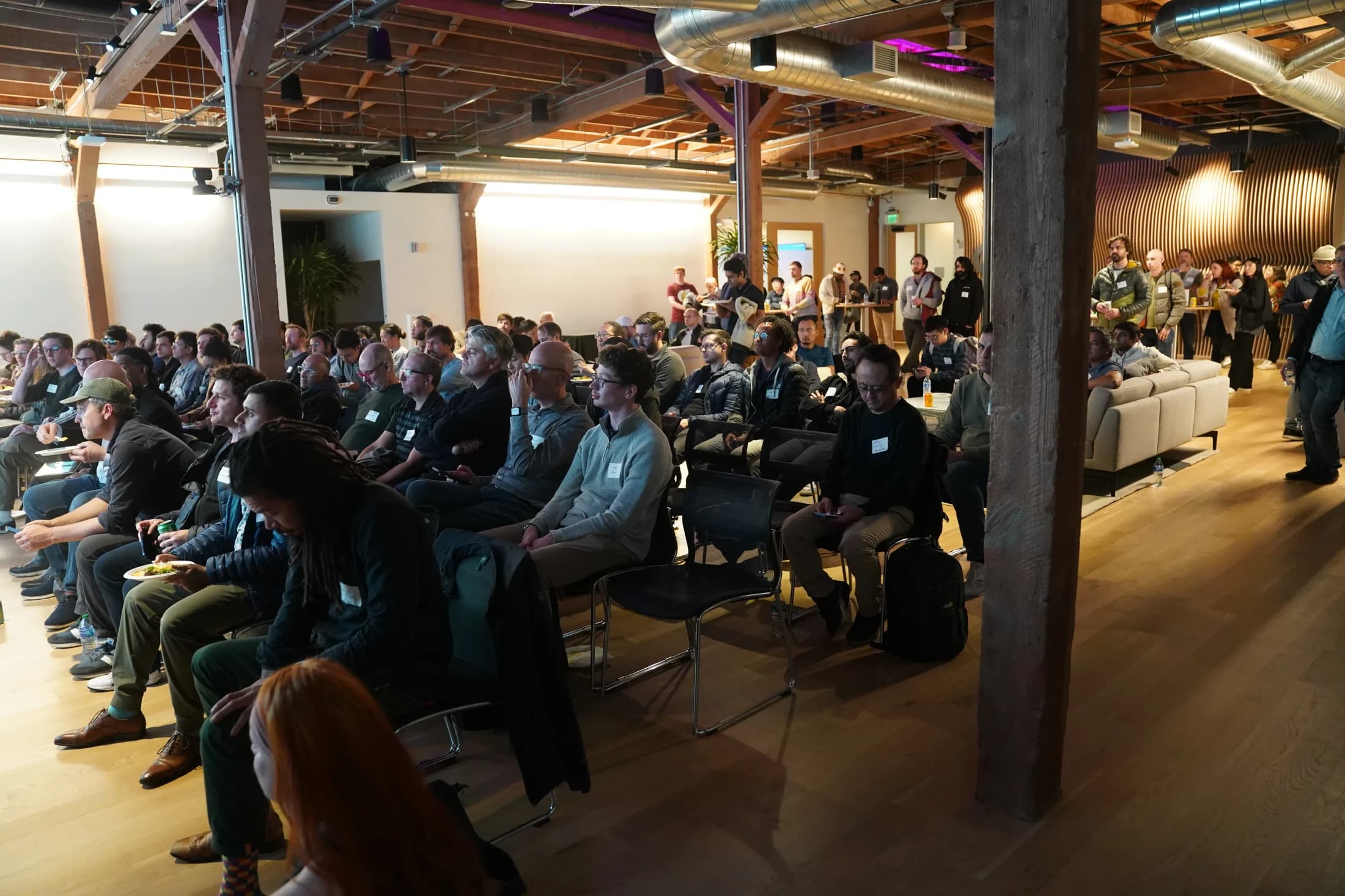 A full audience following the presentation at a16z.