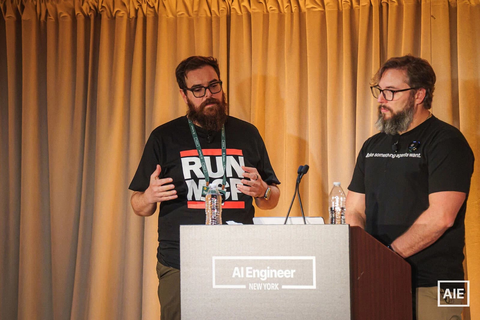 Zack speaking with Nick beside him at the AI Engineer New York podium.