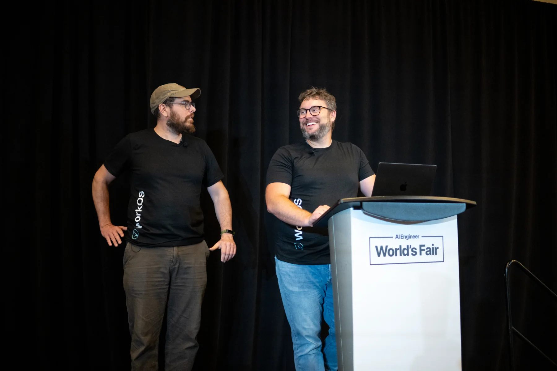Zack and Nick on stage at the AI Engineer World’s Fair lectern.