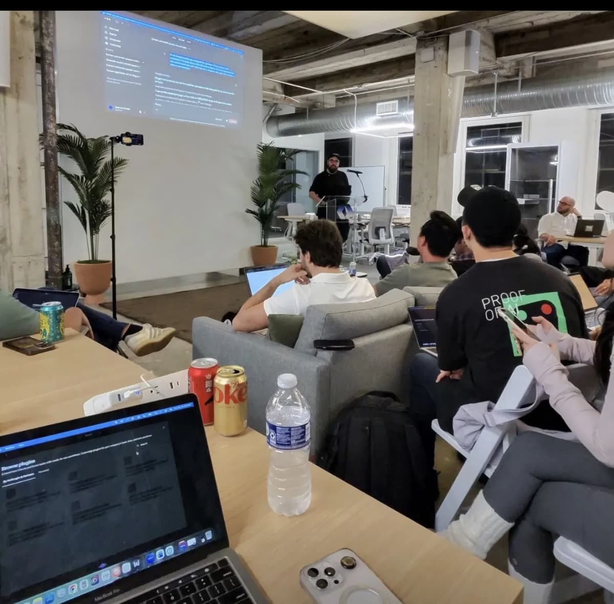 Workshop attendees following along on their laptops during the hands-on Claude Cowork build